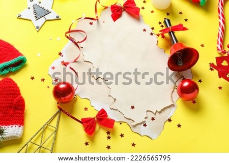 Composition with blank letter to Santa and Christmas decorations on yellow background