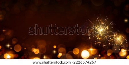 New Year color bokeh background and bengal light . Royalty-Free Stock Photo #2226574267