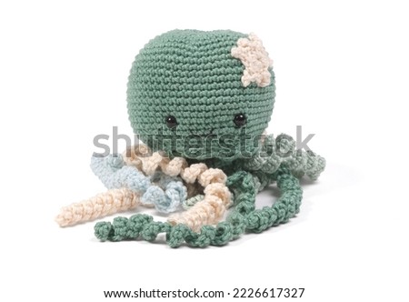 Crochet squid or octopus, isolated on white