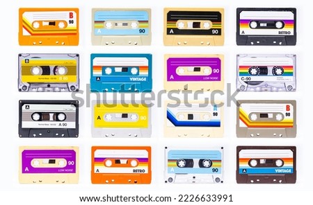 A collection of cassette tapes with different plain labels Royalty-Free Stock Photo #2226633991