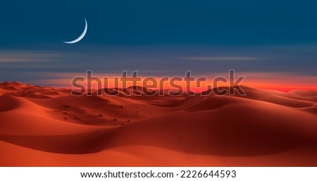 Sand dunes in the Sahara Desert with crescent moon, Merzouga, Morocco - Orange dunes in the desert of Morocco - Sahara desert, Morocco Royalty-Free Stock Photo #2226644593