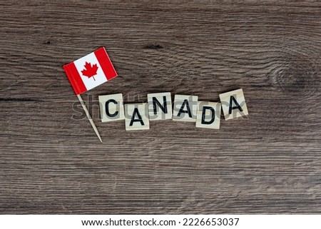 Canada - wooden word with canadian flag (wooden letters, wooden sign)