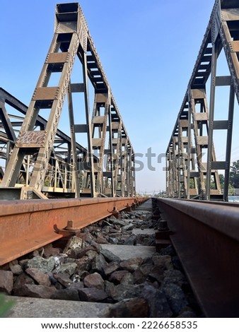 train tracks picture of a bridge over a railway track.