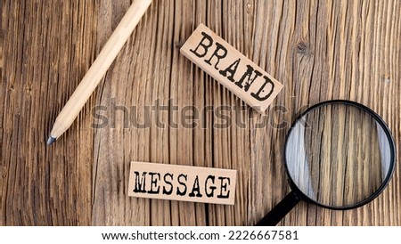 BRAND MESSAGE words on a wooden building blocks on the wooden background