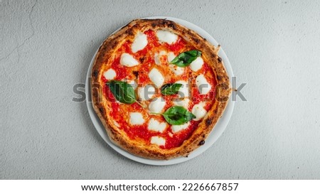 A top view of a pizza Margherita on a table