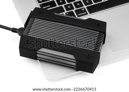 External USB hard drive isolated on white background. Waterproof protected external hard drive. Hard disk for connecting to a laptop, transferring data between a computer and a hard disk.
