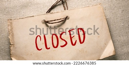 Close up conceptual shot of a business idea showing Closed