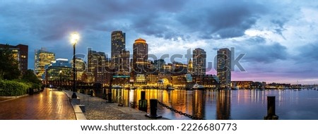 Panorama of Boston cityscape at Fan Pier Park at night, USA