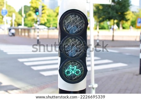 Modern bicycle traffic light on city street