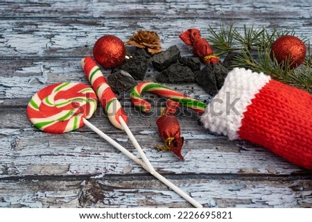 composition with sweet coals, stockings and candies from la befana