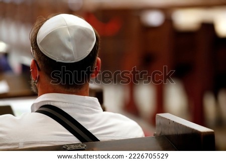 Jewish man wearing a kippah in a synagogue.  Trieste. Italy.  Royalty-Free Stock Photo #2226705529