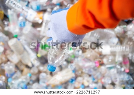 close up worker hand with the separation of plastic bottles recycling industry