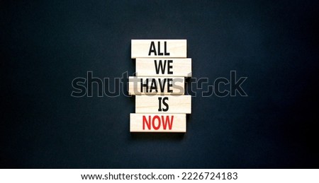 All we have is now symbol. Concept words All we have is now on wooden blocks. Beautiful black table black background. Business, motivational all we have is now concept. Copy space.