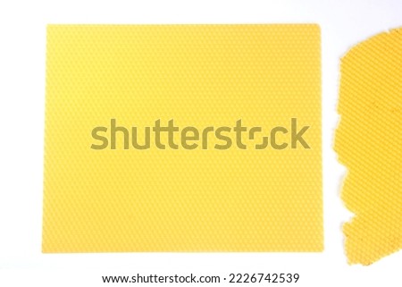 Texture of honeycomb. Bright yellow honey background. Honey cells.