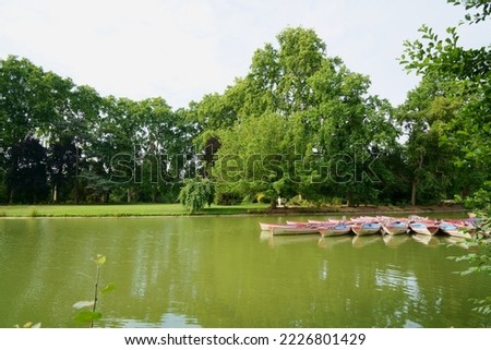 Beautiful green lake, boats, waterscape