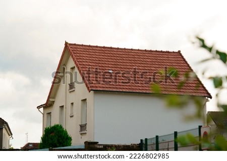 red tile house after rain