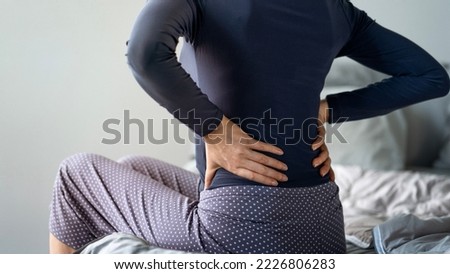 Woman with pain in back