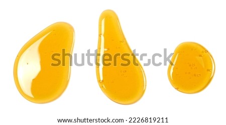 Set honey spill isolated on white, top view Royalty-Free Stock Photo #2226819211