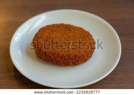 Rice nuggets or croquette, A nasi disk or nasibal (Nasischijf) is a deep fried snack that consists of nasi goreng with bread crumb layer around it, The disc is mainly known in the Netherlands, Belgium