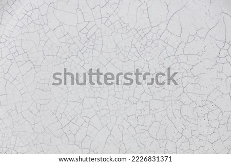 Cracked ceramic texture. Cracked white ceramic background. Royalty-Free Stock Photo #2226831371