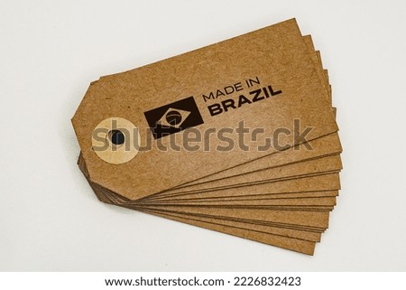 Bunch of cardboard labels with 'Made In Brazil' inscription and flag.