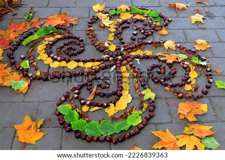 Ornament of autumn maple leaves and chestnuts on city street. Flower painting, image. Children s creativity in fall season