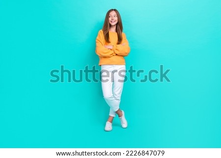 Full body photo of confident satisfied woman folded hands looking empty space looking empty space isolated on aquamarine color background