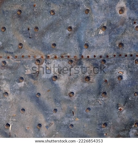 Old metal plate. For use as a background or texture.