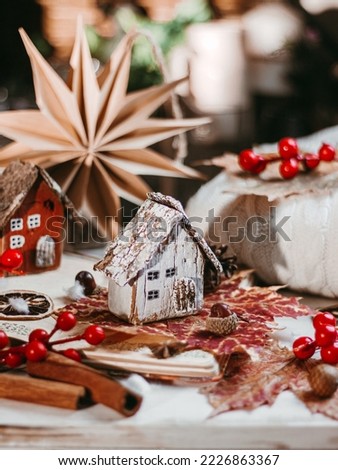 Selective focus of mini wooden house in winter decoration concept. Selective focus