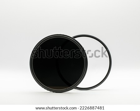 Set of screw-on photographic glass filters for UV protection and reflections and variable ND, neutral density filter to reduce amount of light isolated. on white background.