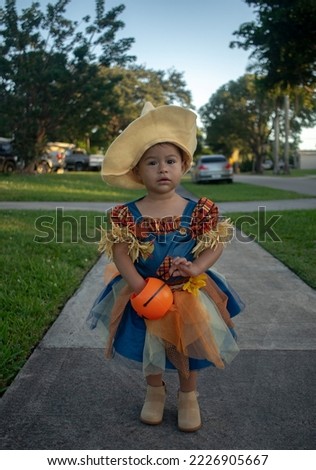 Baby girl scarecrow in halloween
