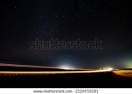 Hail, Medina, Saudi Arabia. February 1st, 2022. A night shots on the highway. Long exposure photo that shows night lights and stars.