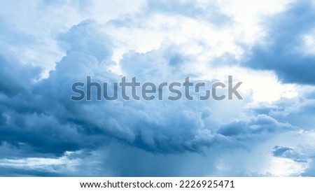Clouds in the blue sky. Natural sky background texture, beautiful color. Peaceful blue sky with light clouds. The free form beauty of clouds and sky is perfect for background, backdrop and wallpaper.
