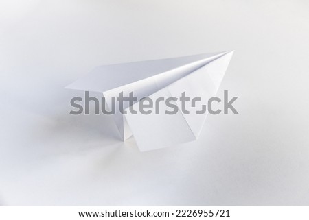 Paper plane origami isolated on a blank white background