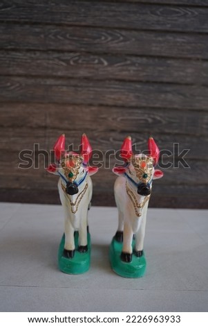 pair of two beautiful ceramic model of cow. "selectivefocus" "shallowdepthoffeild"or "blur".