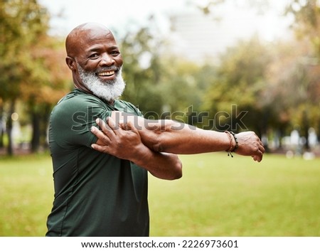 Senior fitness, exercise and black man stretching outdoor at park for energy, health and wellness in retirement. Portrait, face and smile of male in nature for workout, cardio and training in summer Royalty-Free Stock Photo #2226973601