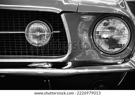 Photography of a car headlight. Transport. Auto poster Royalty-Free Stock Photo #2226979013