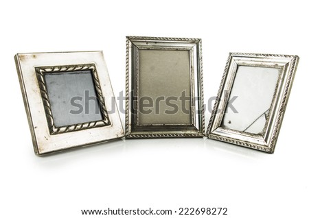 threee metallic silver photo frames isolated on white