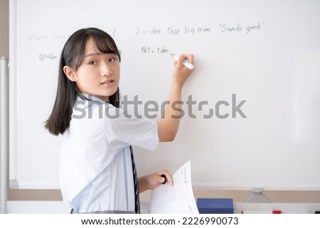 Junior high school students taking classes Royalty-Free Stock Photo #2226990073