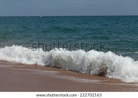 Splashing wave at Mediterranean sea coast.