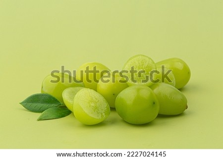 A bunch of Shine Muscat green grape on green background Royalty-Free Stock Photo #2227024145