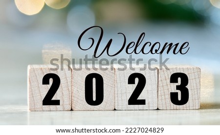 Welcome 2023 year text on wooden blocks.