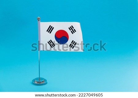 South Korean table flag on blue background.