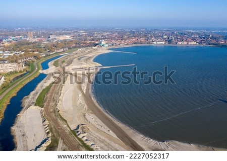 Drone photo of the IJsselmeer near Hoorn, the Netherlands. Here a recreational beach and nature reserve are created with sprayed sand.