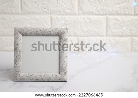 Photo frame on table mockup