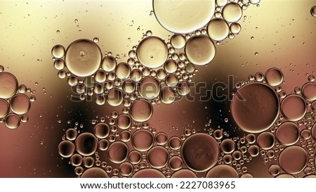 Abstract Colorful Food Oil Drops Bubbles and spheres Flowing on Water Surface Macro Photography Royalty-Free Stock Photo #2227083965