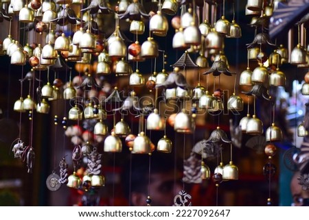 Golden bells decorative items small bells  Royalty-Free Stock Photo #2227092647
