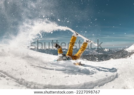 Snowboarders fail offpiste. Concept of safety at ski resort Royalty-Free Stock Photo #2227098767