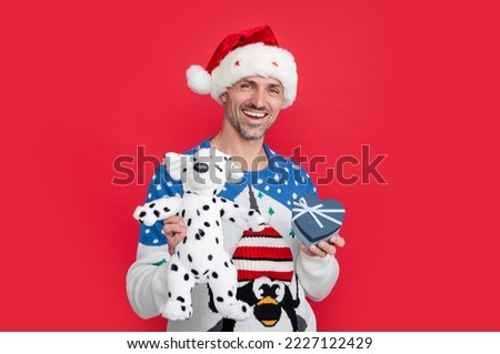 merry christmas and happy new year. happy man hold christmas gift. santa claus man with new year
