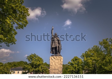 Statue of king Alfred the Great in the medieval town of Winchester in Wessex, England. Royalty-Free Stock Photo #2227136151